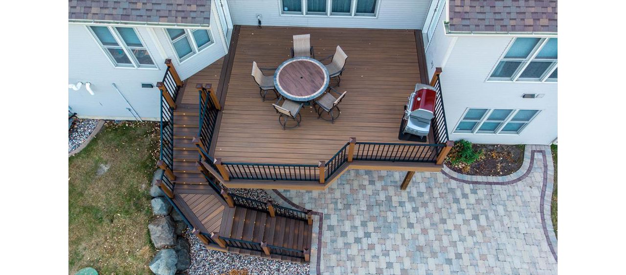 This deck has Trex elevations framing and Trex Transcend decking. Add in the Trex LED lights and this is now the new dining room.