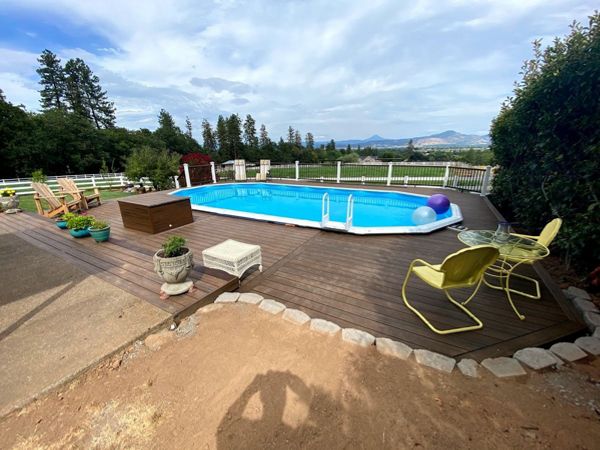 Extend pool deck around pool