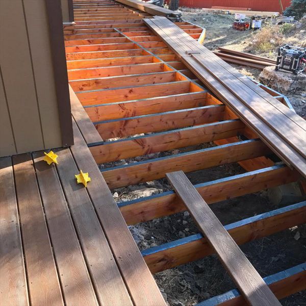 Installing Trex boards. First we install deck tape on top of the Joists to protect them for years to come from water damage.