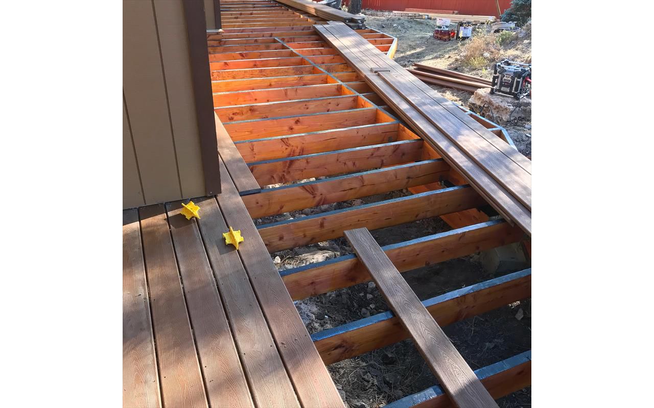 Installing Trex boards. First we install deck tape on top of the Joists to protect them for years to come from water damage.