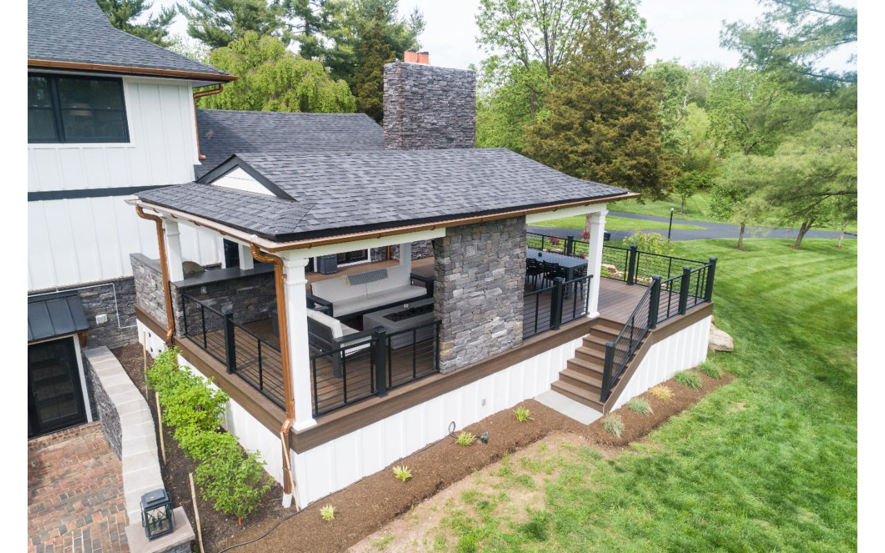 Trex Deck with Spiced Rum Decking, Trex Rod Rail, Custom Roof & Stonework