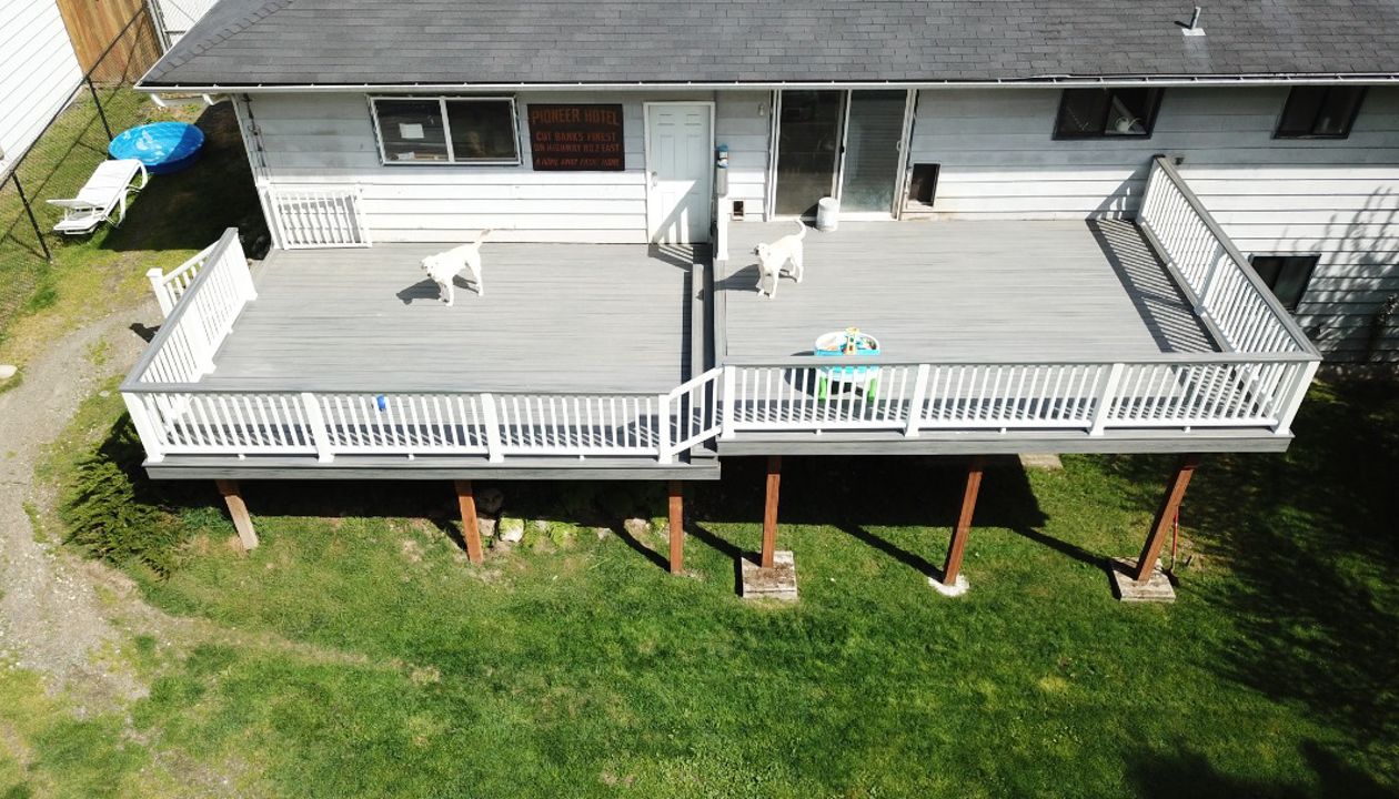 Trex Island Mist Decking with White Transcend Railing.