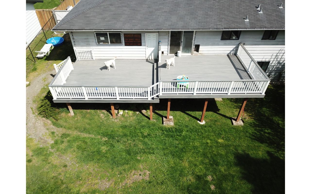 Trex Island Mist Decking with White Transcend Railing.