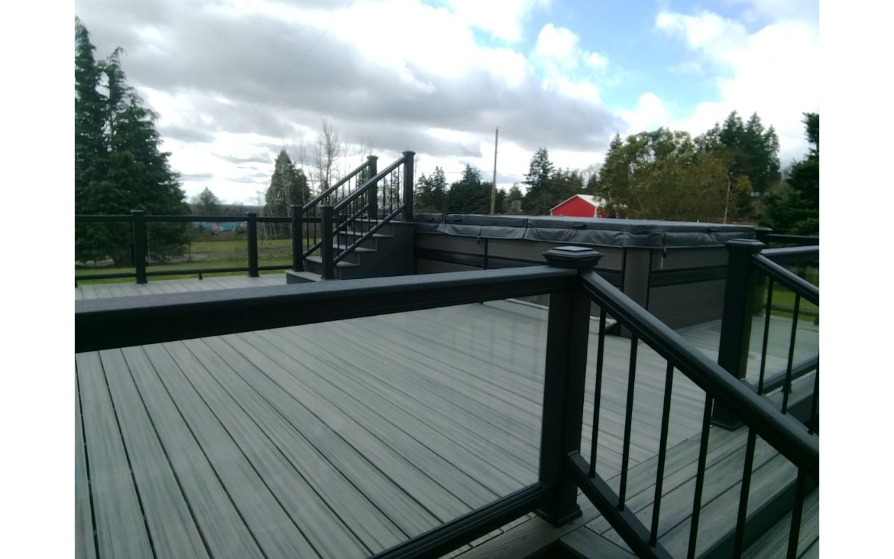 Glass infill with lighted postcaps on swim spa deck