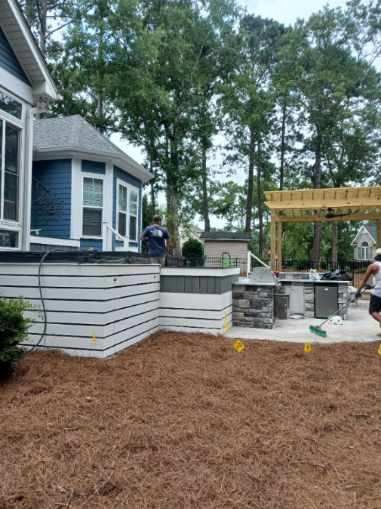 The blue siding & white trim compliment this Trex Select grey combo perfectly!