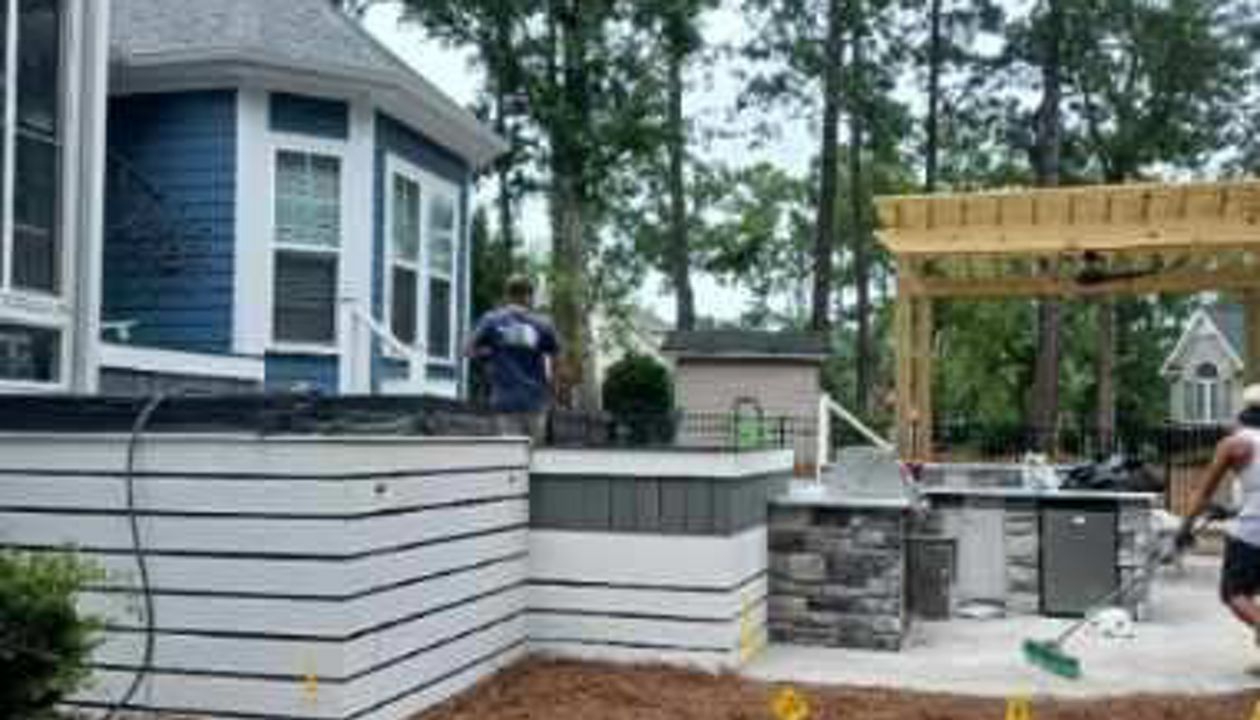 The blue siding & white trim compliment this Trex Select grey combo perfectly!