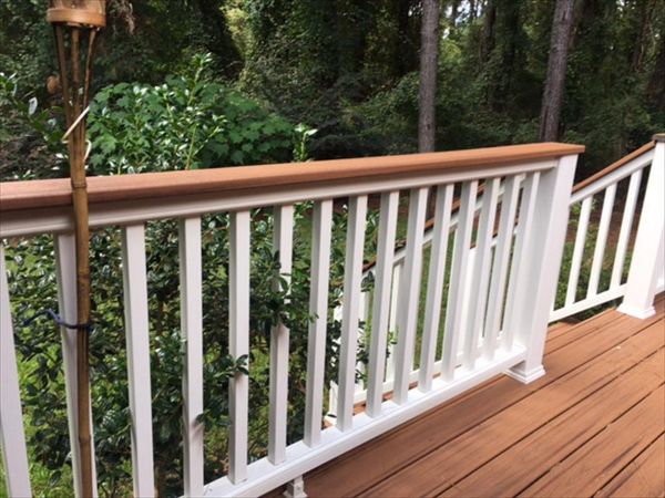 Trex Transcend Classic White railing with Tiki Torch cocktail is perfect spot to lean or rest your drink.