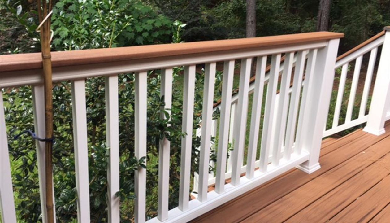 Trex Transcend Classic White railing with Tiki Torch cocktail is perfect spot to lean or rest your drink.