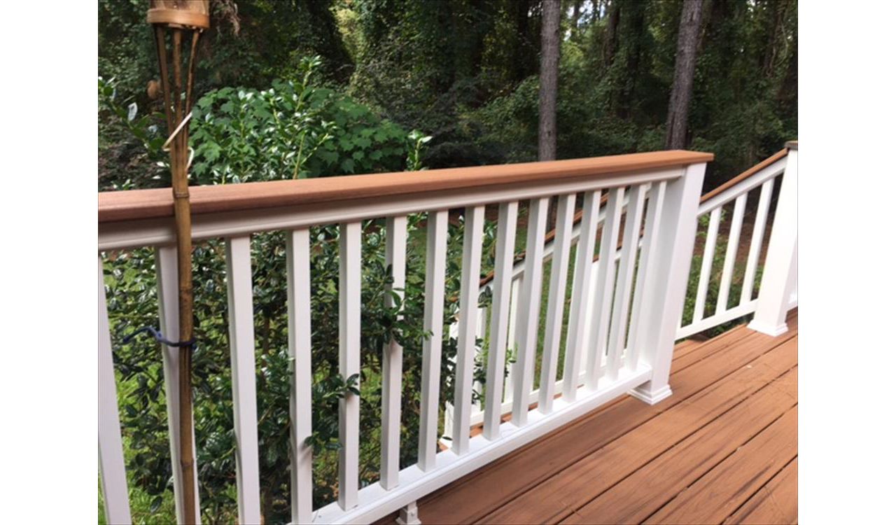 Trex Transcend Classic White railing with Tiki Torch cocktail is perfect spot to lean or rest your drink.