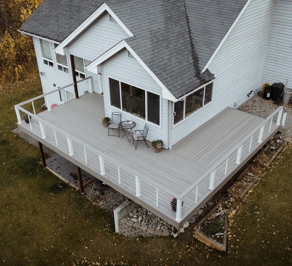 Trex Enhance Rocky Harbor with White railing components evokes a sea-side feel for this lakefront property.
