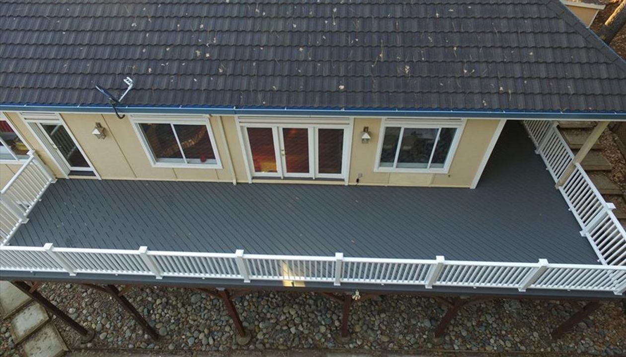 Custom Trex Deck with White Trex Transcend Railing.