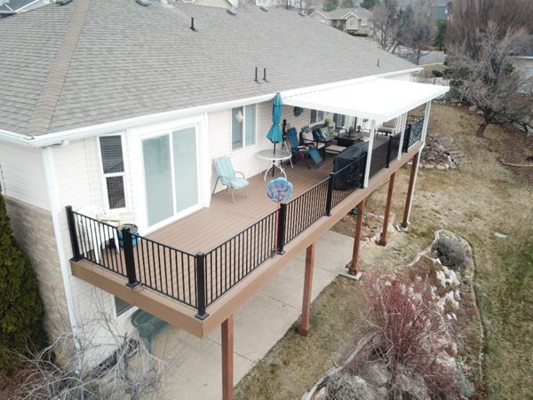Saddle Decking with Black Steel Railing with an Overhang