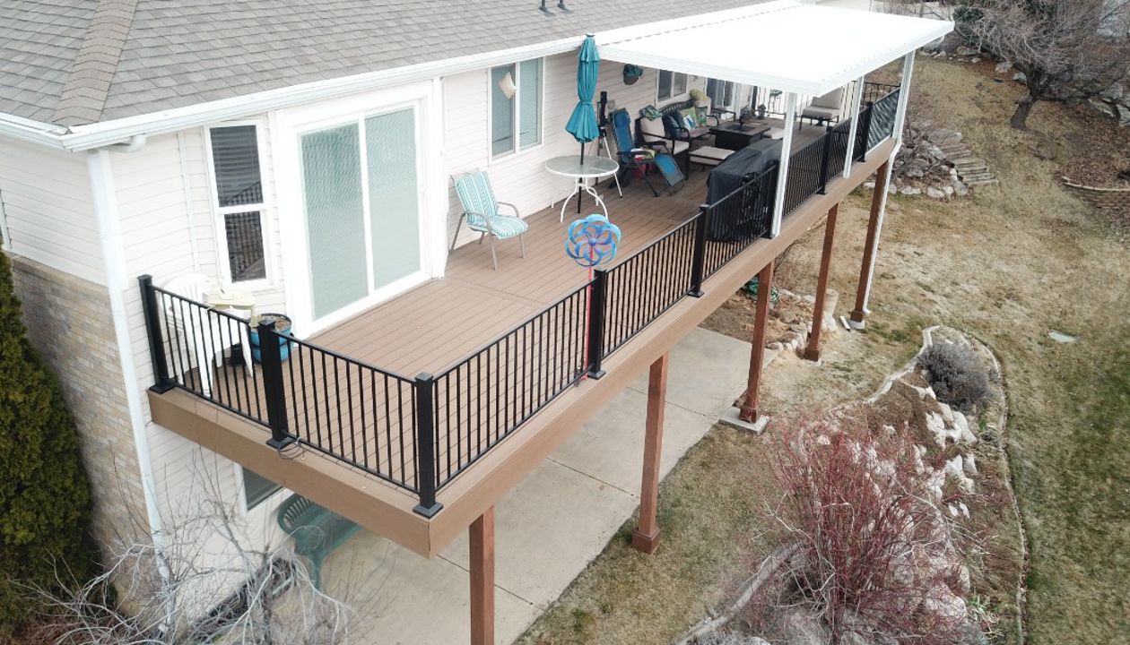 Saddle Decking with Black Steel Railing with an Overhang