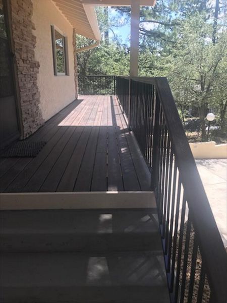 Prescott AZ. Lava Rock with groove, hidden clips. Trex joist tape. 2x4 Lava Rock railing cap.