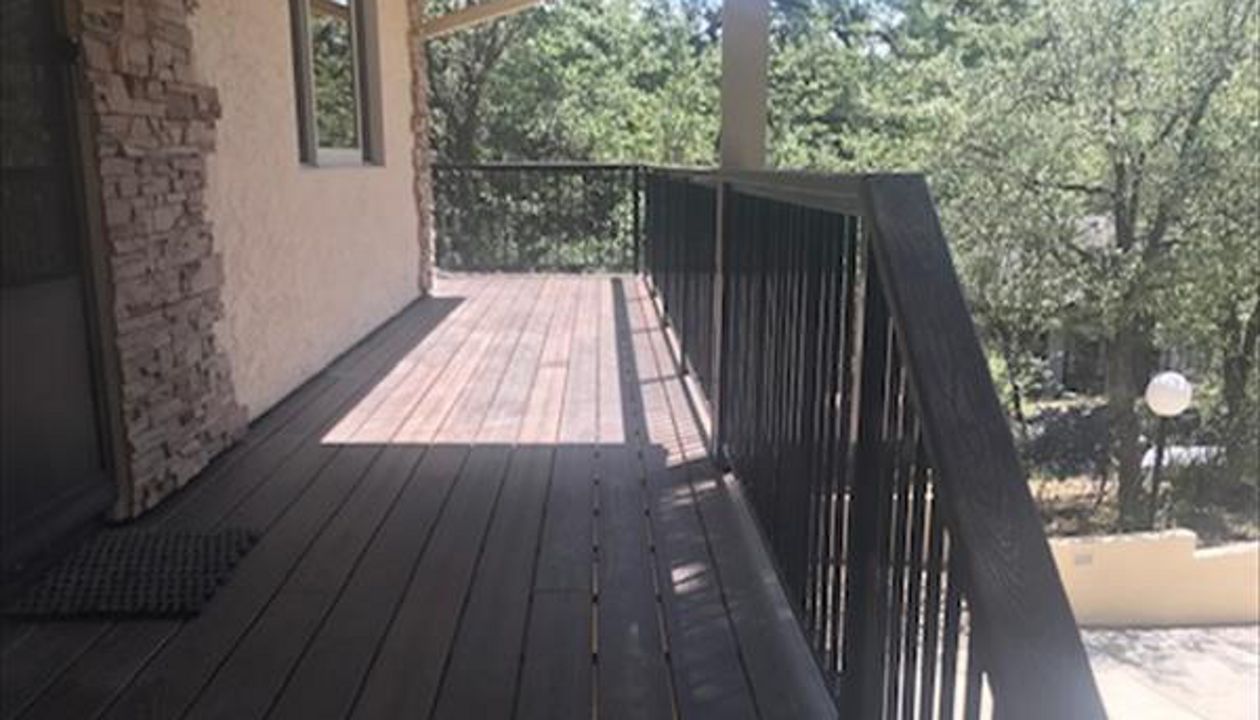 Prescott AZ. Lava Rock with groove, hidden clips. Trex joist tape. 2x4 Lava Rock railing cap.