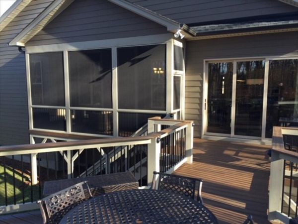This Trex Transcend Spiced Rum deck in Wake Forest, NC leads nicely into this screened porch area.