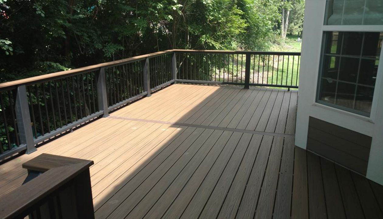 Cocktail rail, Spiced rum, black post and rails, square aluminum balusters, Vintage lantern accent