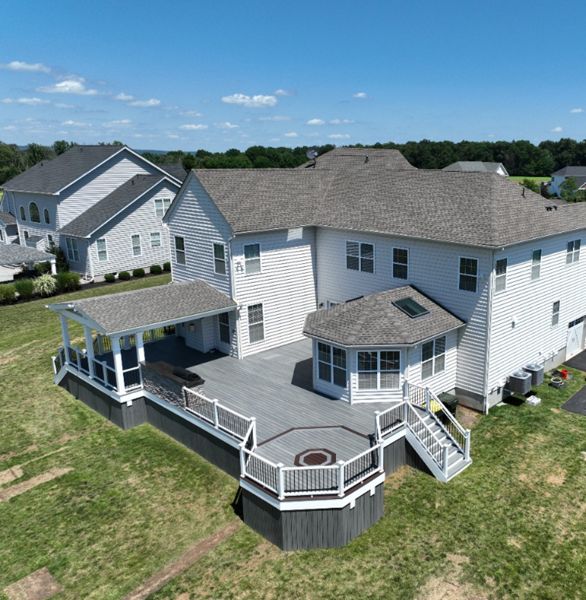 Trex Deck with Island Mist Decking, Trex Transcend Railing, Custom Roof, and Outdoor Kitchen
