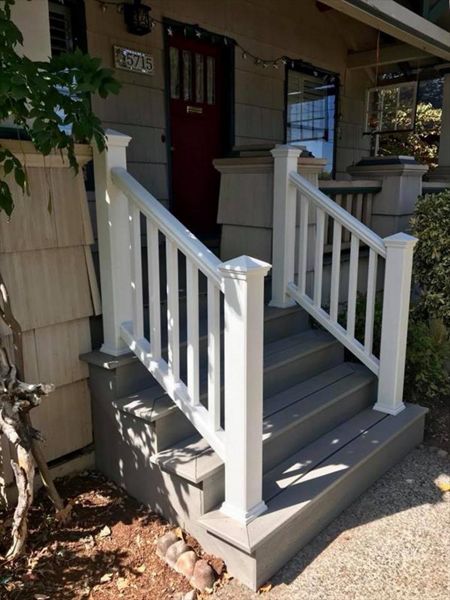 Gravel Path stairs closed off by classic vertical design. The Classic white Transcend Rail is a nice compliment