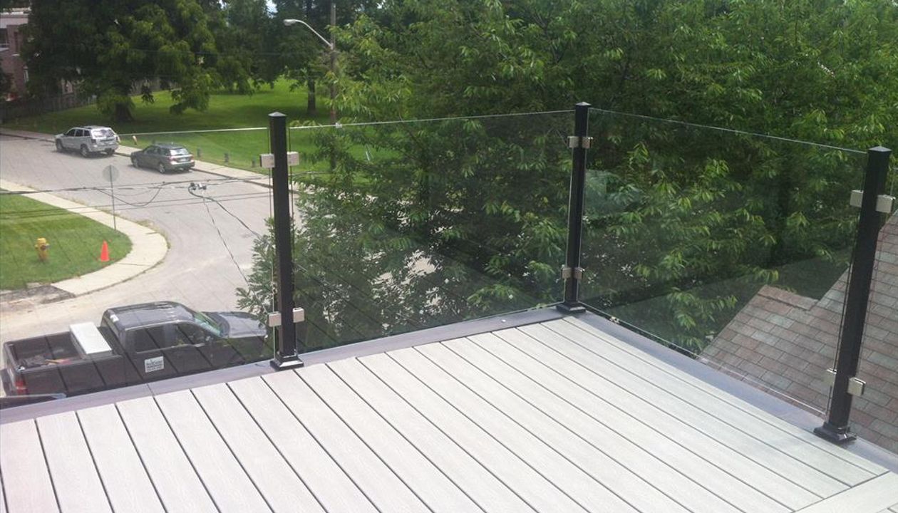 Trex Tropical Spiced Rum custom made COMPOSITE deck with glass and aluminum railing. The deck built in Toronto, Mississauga, Scarborough, Etobicoke, North York, Markham, Richmond Hill, Thornhill, Vaughan