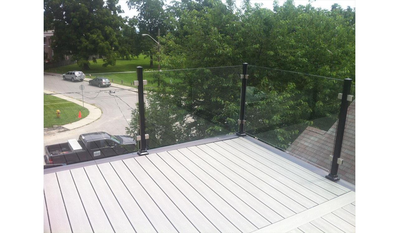 Trex Tropical Spiced Rum custom made COMPOSITE deck with glass and aluminum railing. The deck built in Toronto, Mississauga, Scarborough, Etobicoke, North York, Markham, Richmond Hill, Thornhill, Vaughan