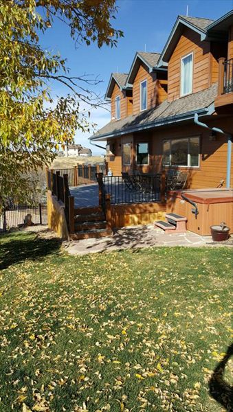 Beautiful Transcend Deck with Iron Railing on both front and rear of home in Franktown