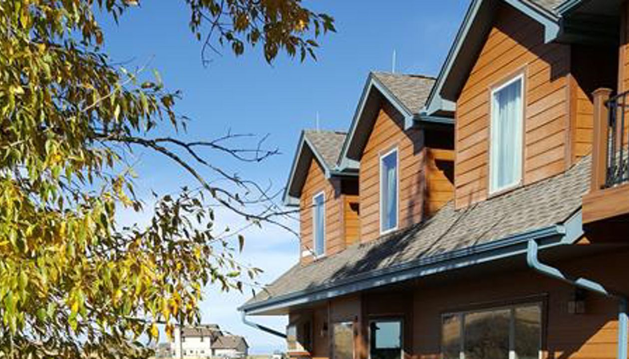 Beautiful Transcend Deck with Iron Railing on both front and rear of home in Franktown