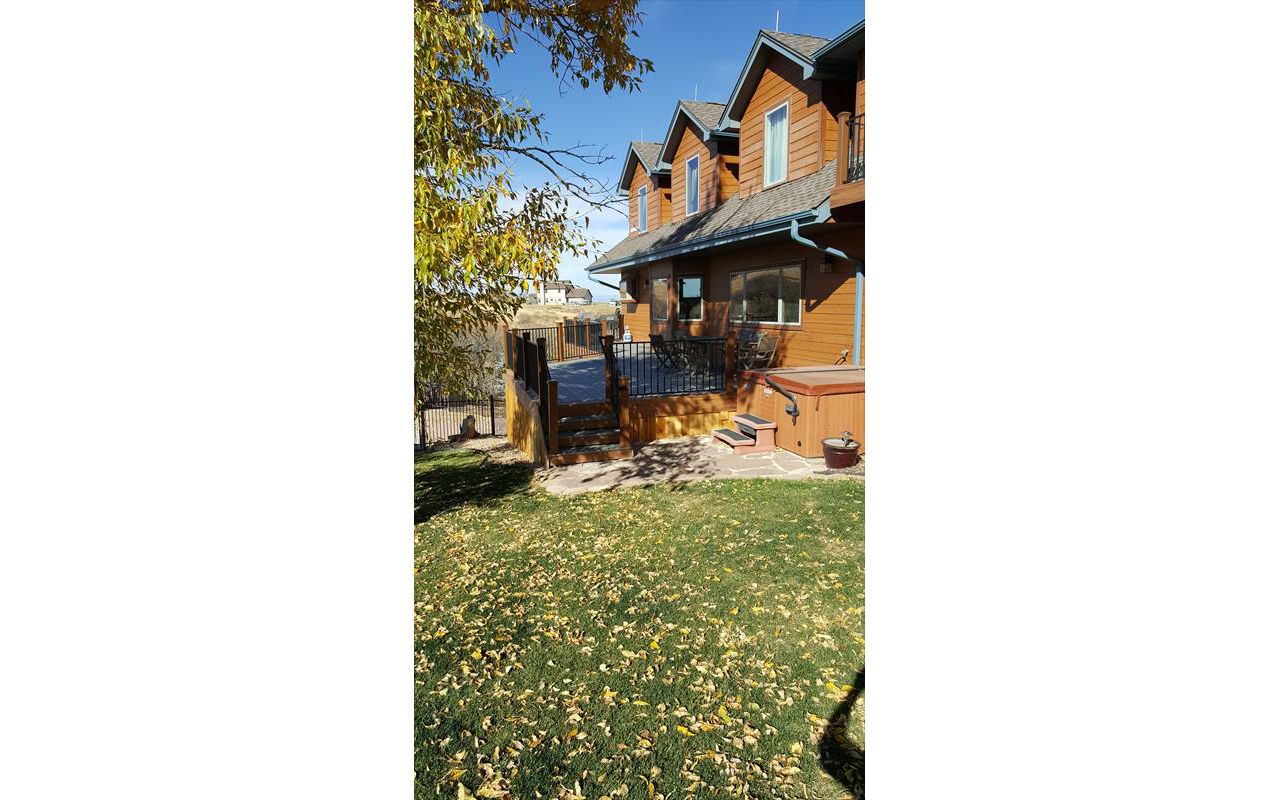Beautiful Transcend Deck with Iron Railing on both front and rear of home in Franktown