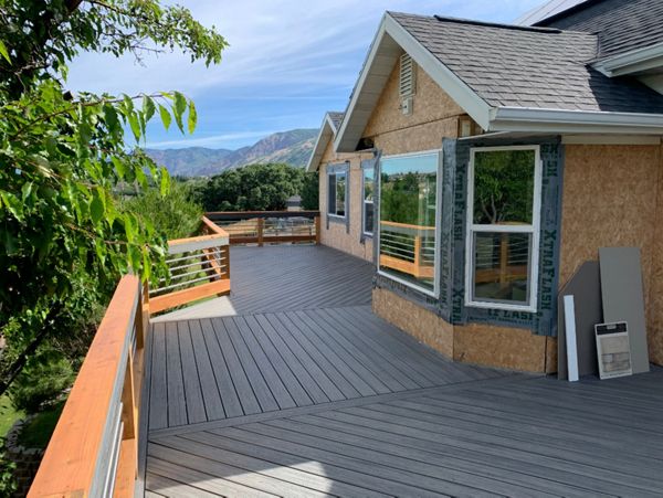 Trex Transcend Island Mist with custom built stainless steel/ redwood railing with Trex Transcend Drink Rail in Weber County, Ut