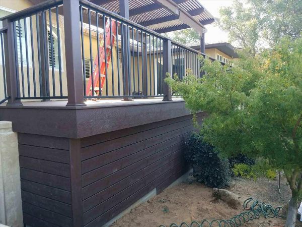 Custom Trex Transcend Vintage Lantern boards as paneling for a nice finished look. Trex Transcend railing with cocktail board on top.