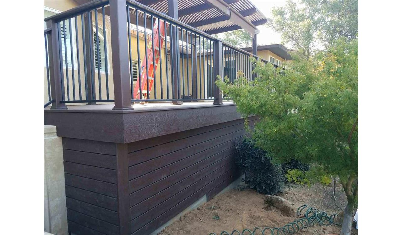 Custom Trex Transcend Vintage Lantern boards as paneling for a nice finished look. Trex Transcend railing with cocktail board on top.