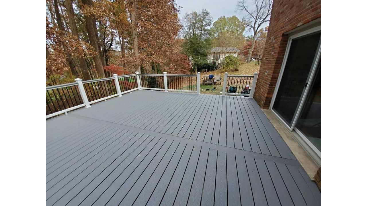 Trex Select Pebble Grey Composite with Trex Select Railing in Classic White with Round Aluminum Balusters in Charcoal Black
