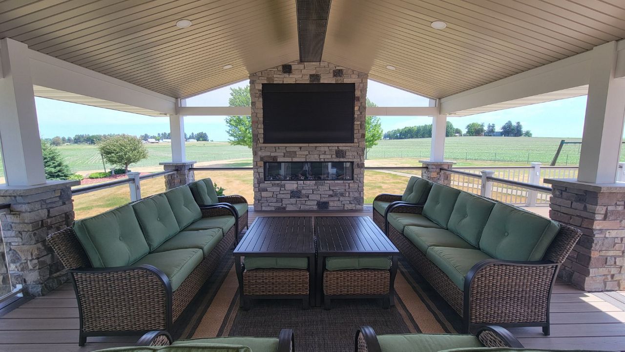 Roof extension on Trex Havana Gold deck, with Trex glass railing