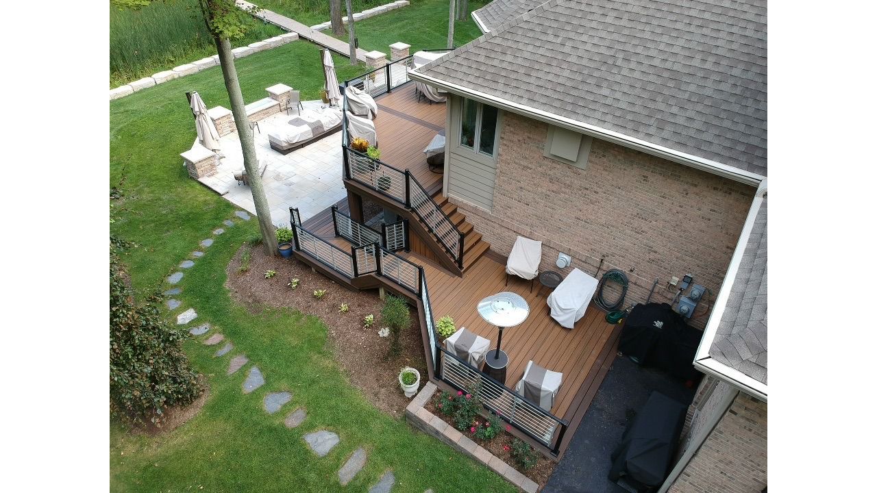 Trex Havana Gold decking with a double Spiced Rum border. Also including a Trex Signature Platinum Rod Railing.