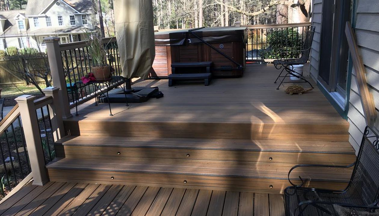 Trex Havana Gold fascia boards with riser lights are essential for great backyard parties