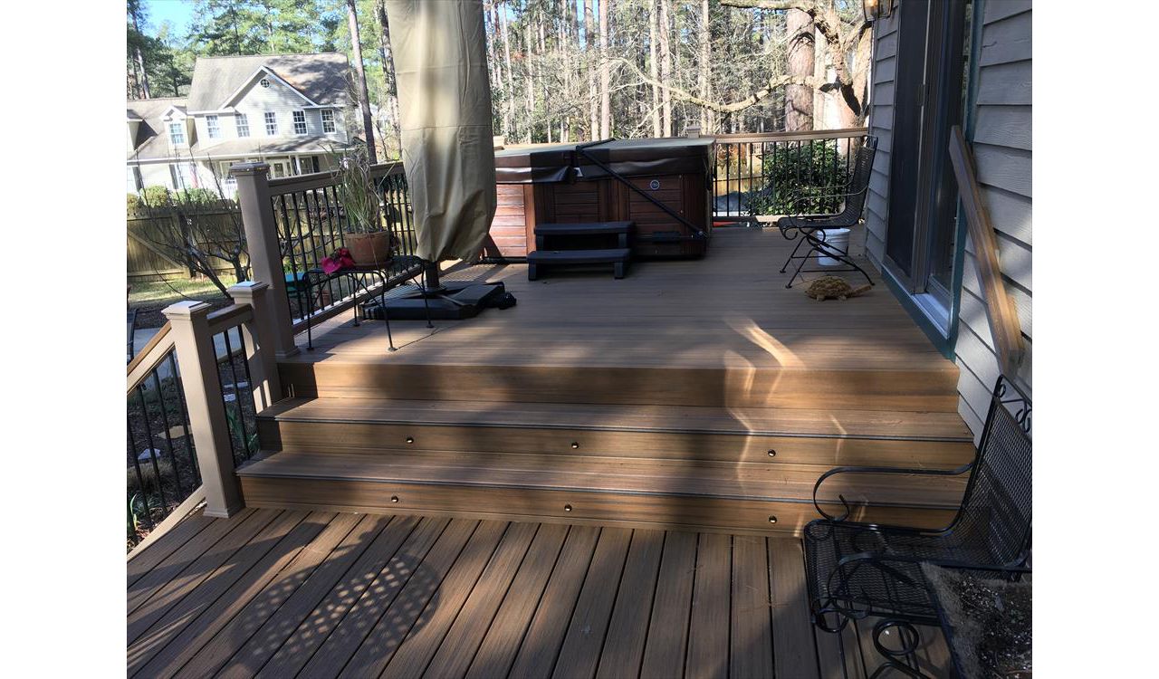 Trex Havana Gold fascia boards with riser lights are essential for great backyard parties