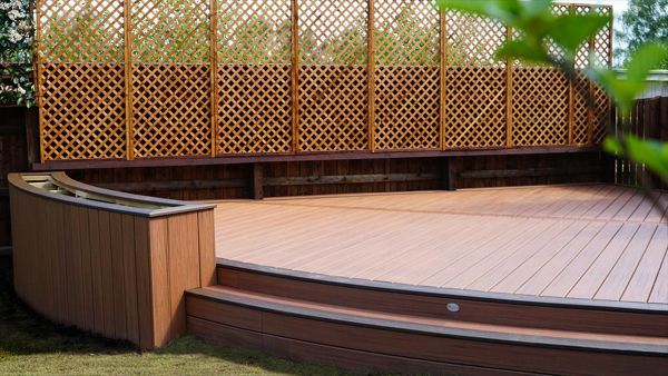 Here in Weldon Northamptonshire we made use of a corner of the garden by building this Trex custom curve deck, what a project plenty of curved decking boards needed to complete this deck but well worth the hard work it stands proud in the garden.