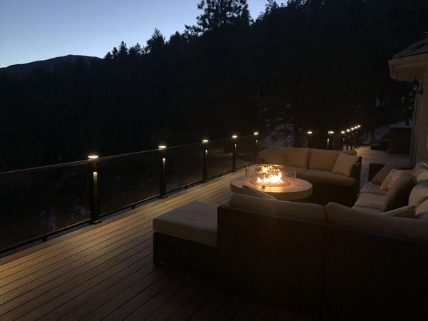 Tiki Torch, Lava rock border, Trex glass railings and lights, Elevation Steel frame