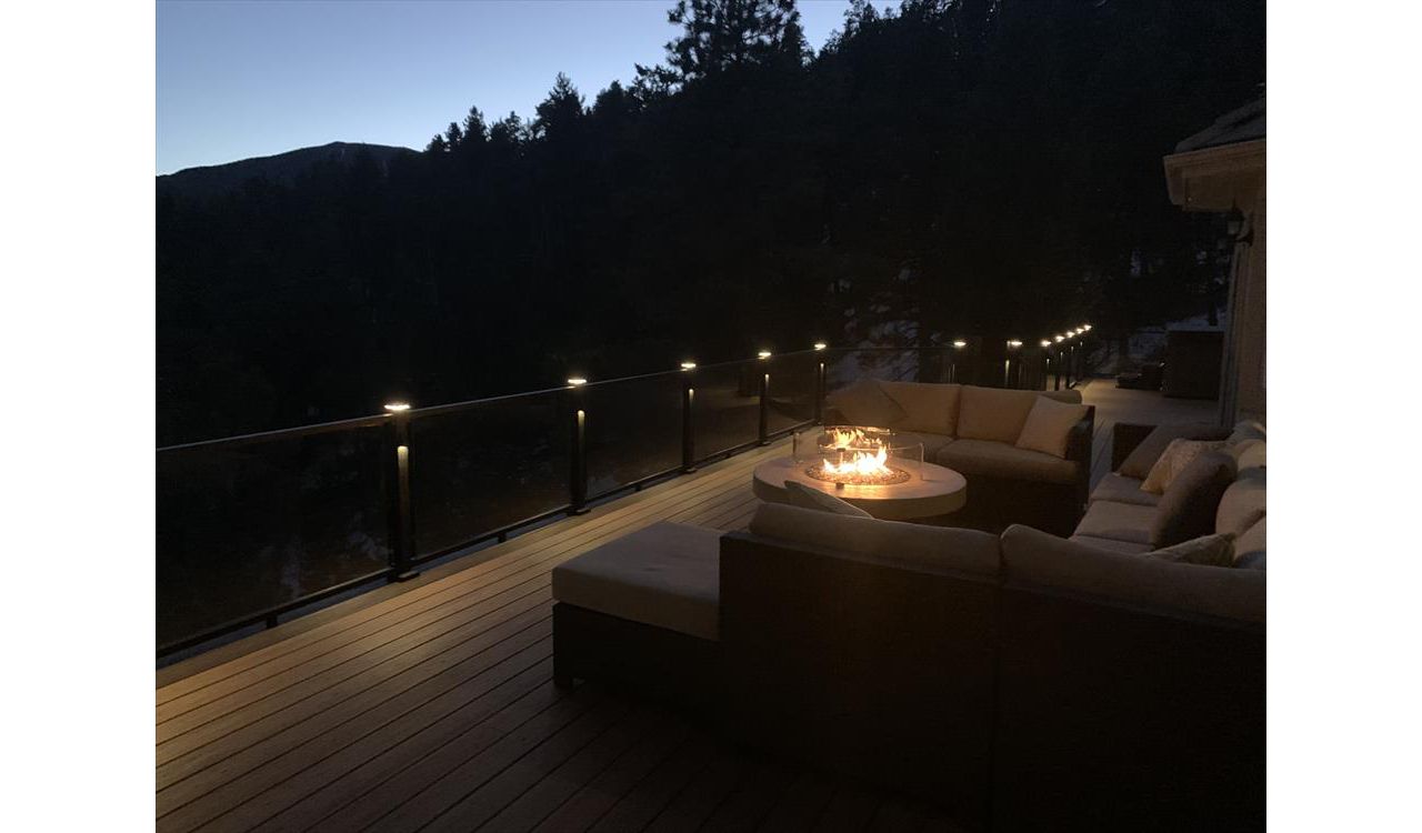 Tiki Torch, Lava rock border, Trex glass railings and lights, Elevation Steel frame