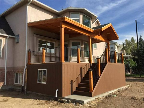 Composite saddle Trex with matching skirting, under deck storage with door and window, Trex rainscape, Gable over entire deck