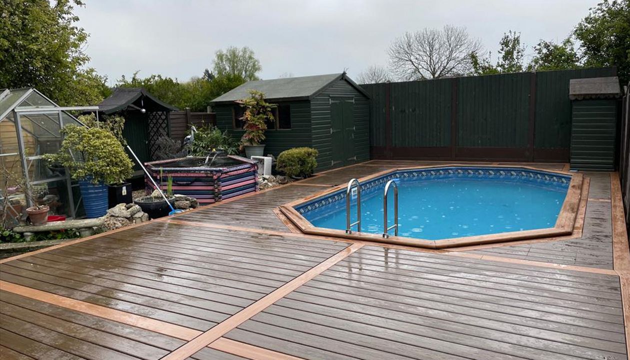 Trex Transcend Tropicals Spiced Rum with Trex Transcend Tiki Torch accents for thgis pool deck in Sidcup Kent.