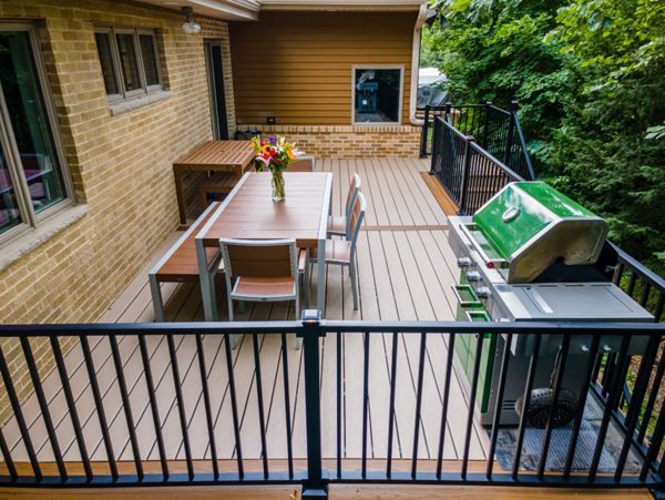 Trex furniture is the perfect match for a Trex deck. The LED lighting on the Signature railing adds ambience for evening dinners.