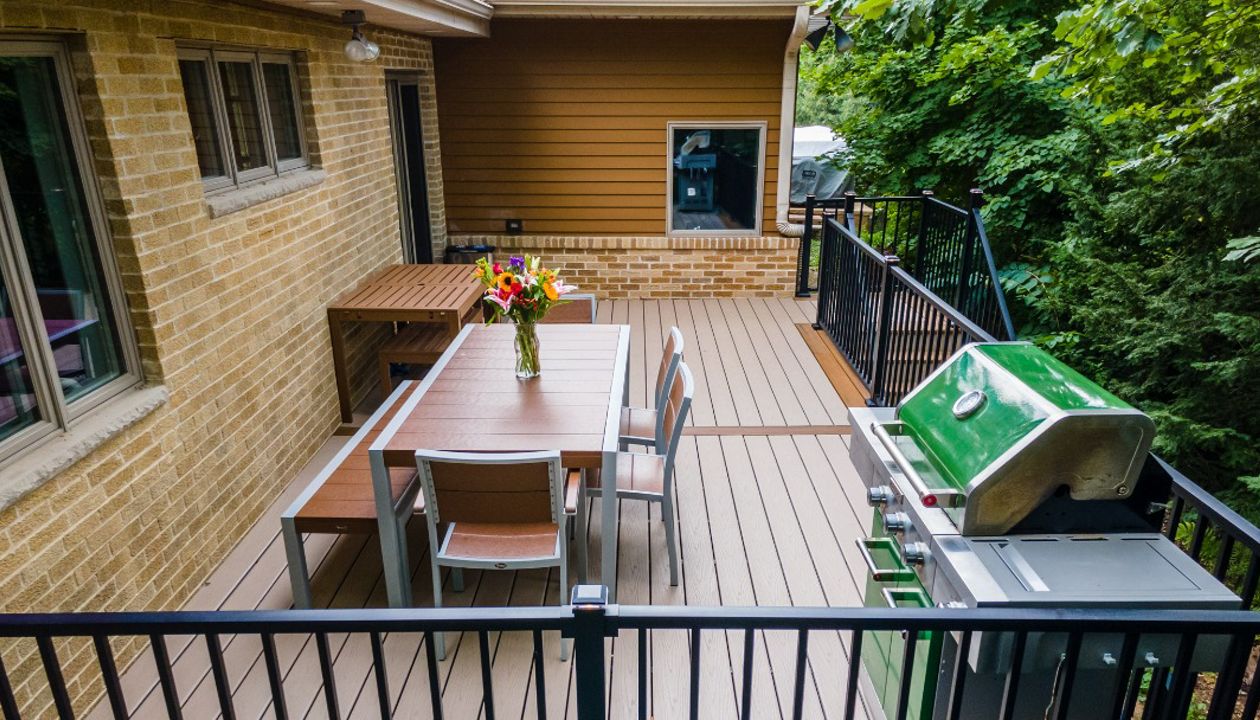 Trex furniture is the perfect match for a Trex deck. The LED lighting on the Signature railing adds ambience for evening dinners.