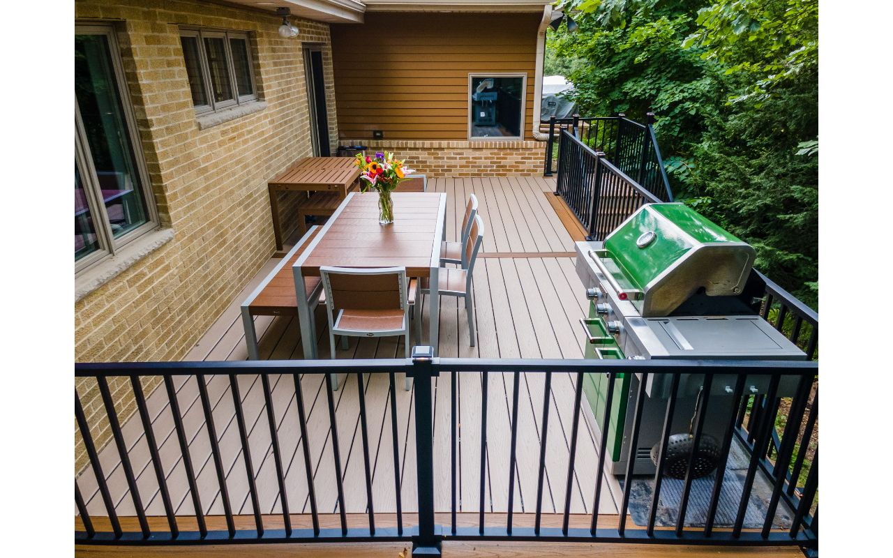 Trex furniture is the perfect match for a Trex deck. The LED lighting on the Signature railing adds ambience for evening dinners.