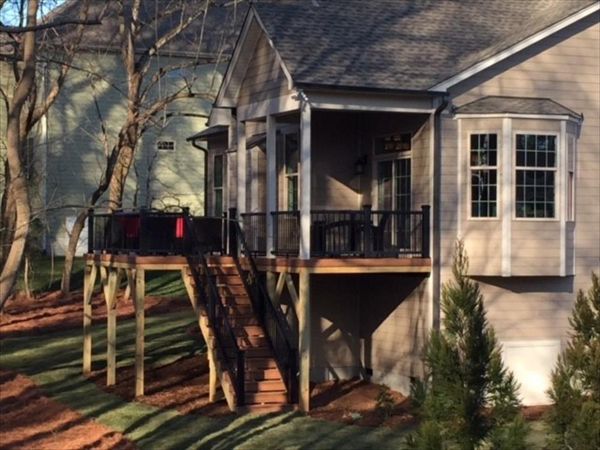Trex Transcend Tiki Torch deck with Transcend Charcoal Black railings in Wake Forest, NC adds to this great backyard.