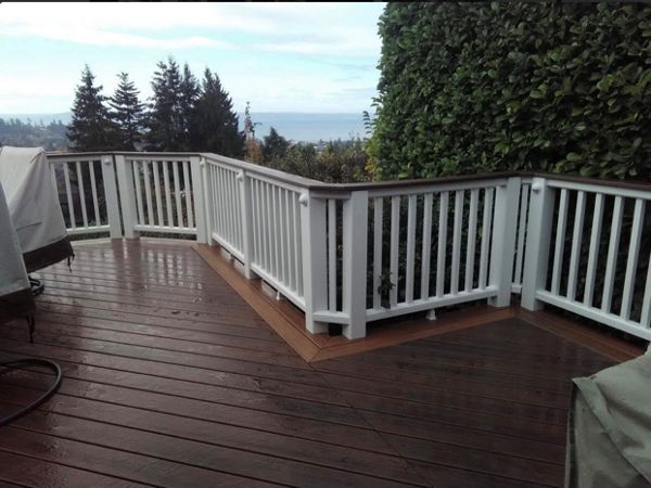 Trex Transcend Lava Rock decking with Tiki Torch border with Trex Transcend cocktail railing