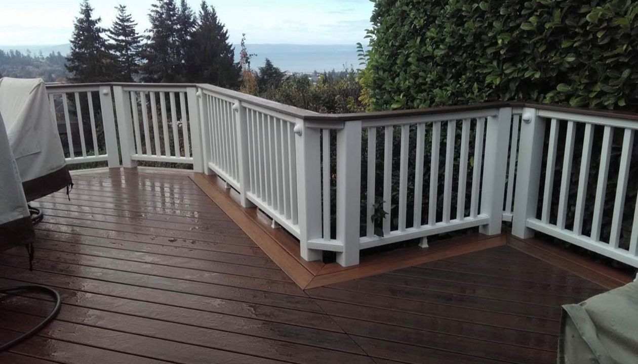 Trex Transcend Lava Rock decking with Tiki Torch border with Trex Transcend cocktail railing