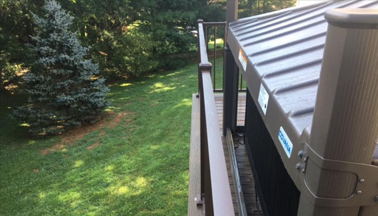 Trex Signature Bronze Aluminum Railing compliment Transcend Spiced Rum decking color.