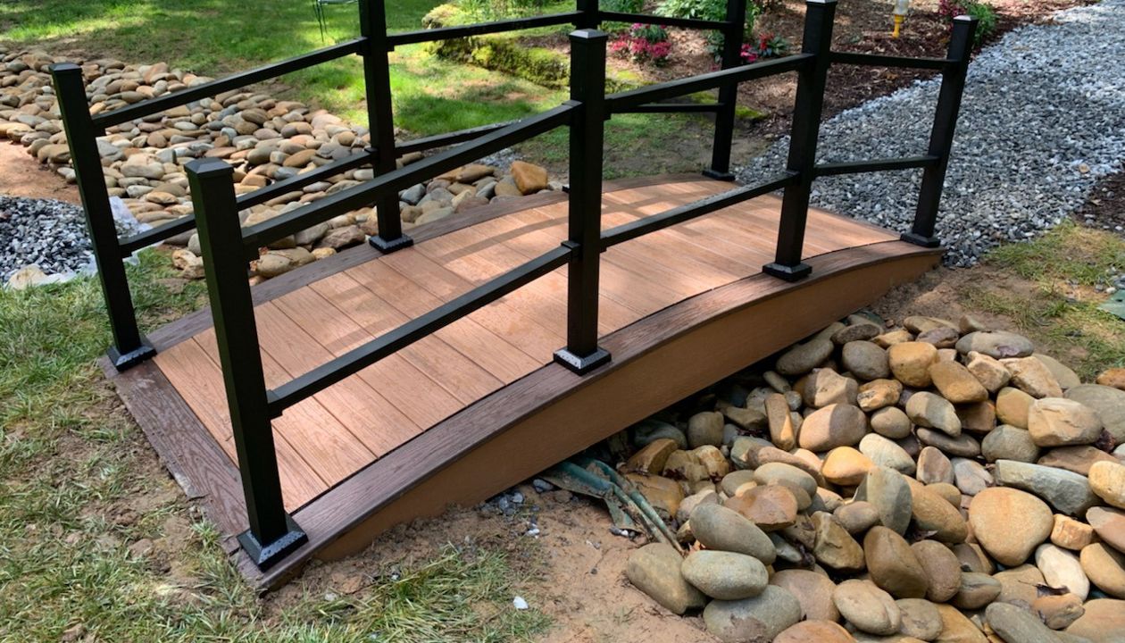 Dry bed bridge made of Tiki Torch trimmed in Spiced Rum with Signature Railing.