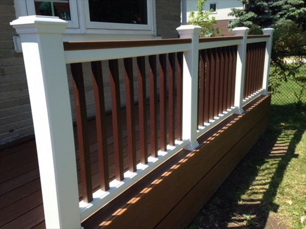 Trex Select Saddle custom made COMPOSITE porch with Trex Select Madeira railing and classic white posts. The Porch built in Toronto, Mississauga, Scarborough, Etobicoke, North York, Markham, Trex